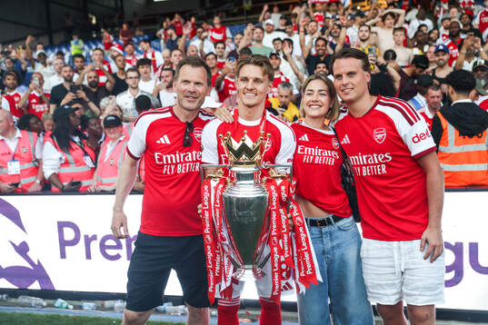 Martin Ødegaard of Arsenal celebrates with the trophy for