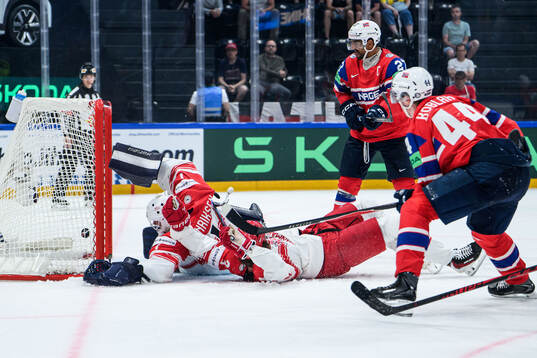 Goaltender Nicolaj Henriksen and Malte Setkov of Denmark