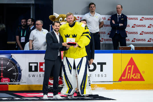 Goaltender Magnus Hellberg of Sweden is awarded player of