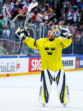 Goaltender Magnus Hellberg of Sweden celebrates