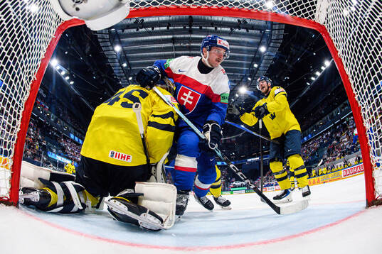 goaltender Magnus Hellberg and Joel Persson of Sweden