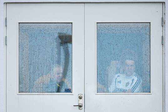 Members of the Swedish national football team take cover