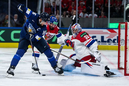 Alexander Barkov of Finland and Michal Kempny and