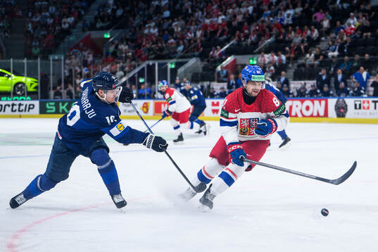 Henri Jokiharju of Finland and Matej Blumel of Czech