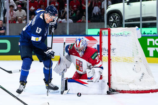 Jesse Puljujärvi of Finland and goaltender Josef Korenar