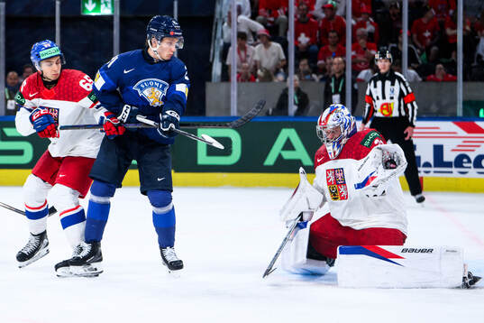 Tomas Cibulka and goaltender Josef Korenar of Czech