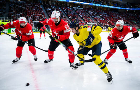 Dean Kukan, Christian Marti and Denis Malgin of Switzerland
