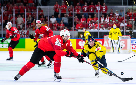 Roman Josi of Switzerland and Oscar Sundqvist of Sweden