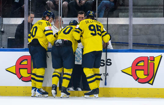 Oscar Sundqvist of Sweden is injured and receives help of