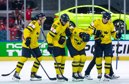 Oscar Sundqvist of Sweden is injured and receives help of
