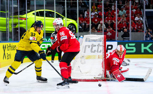 Jakob Silfverberg of Sweden competes with Janis Moser and