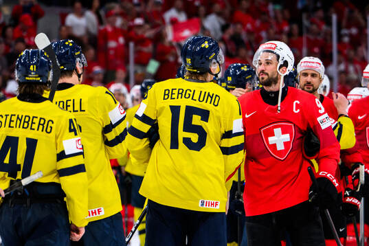 Jack Berglund of Sweden and Roman Josi of Switzerland