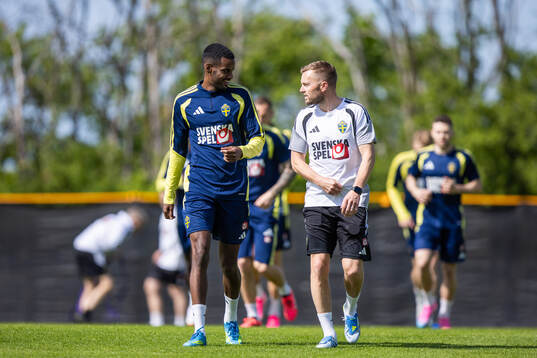 Alexander Isak and assistant coach Sebastian Larsson of the