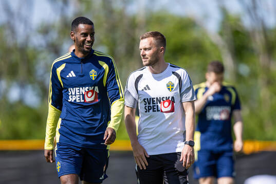 Alexander Isak and assistant coach Sebastian Larsson of the
