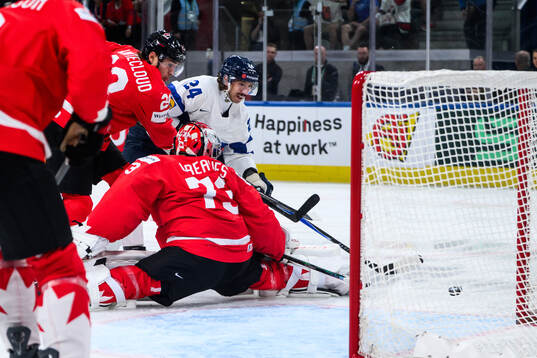 Aatu Räty of Finland and Jet Greaves of Canada