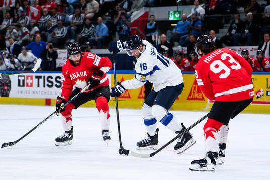 Alexander Barkov of Finland, Conor Brown and Fraser Minten