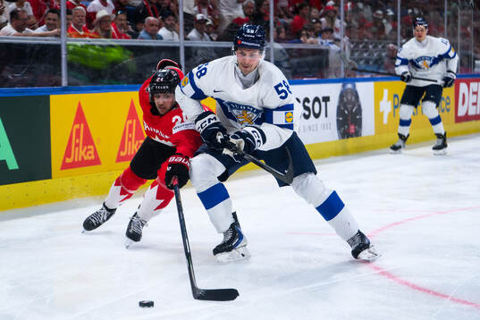 Dylan Cozens of Canada and Urho Vaakanainen of Finland