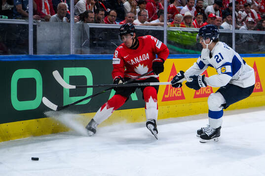 Zach Whitecloud of Canada and Patrik Puistola of Finland