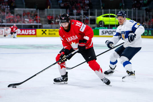 Conor Brown of Canada and Jesse Puljujärvi of Finland