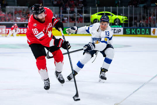 Conor Brown of Canada and Jesse Puljujärvi of Finland