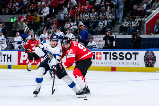 Aatu Räty of Finland and Ryan O’Reilly of Canada