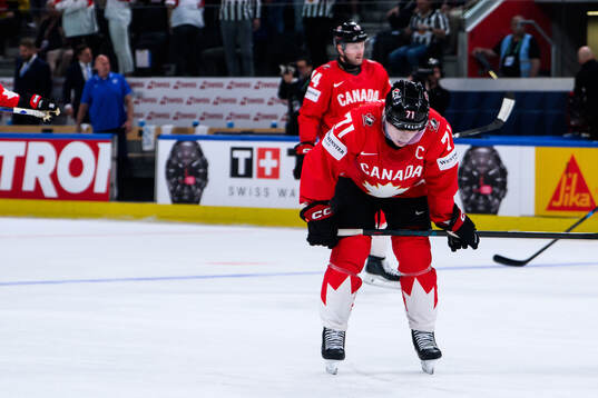 Macklin Celebrini of Canada looks dejected