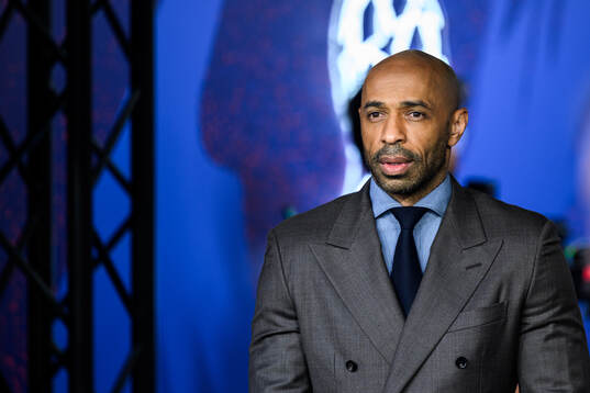 Thierry Henry with the trophy