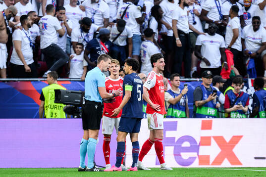 Referee Daniel Siebert, Martin Ødegaard of Arsenal and