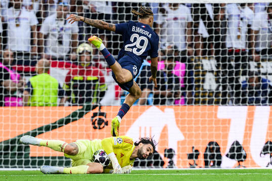 Goalkeeper David Raya of Arsenal and Bradley Barcola of