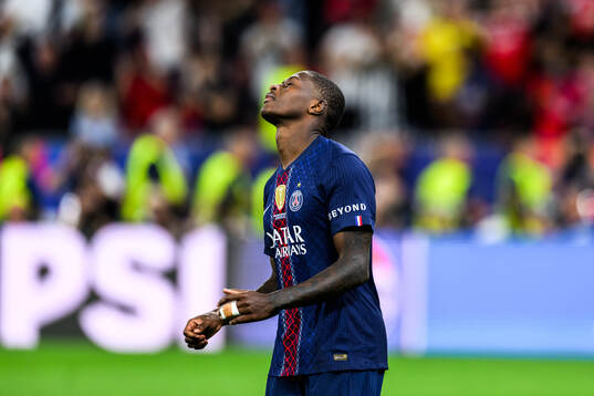 Nuno Mendes of Paris Saint-Germain looks dejected in a