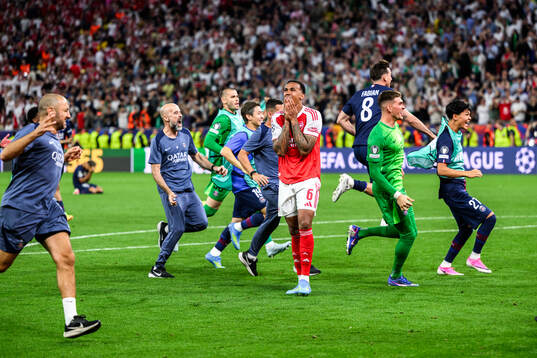 Players of Paris Saint-Germain celebrate and Gabriel of
