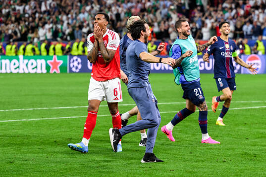Players of Paris Saint-Germain celebrate and Gabriel of