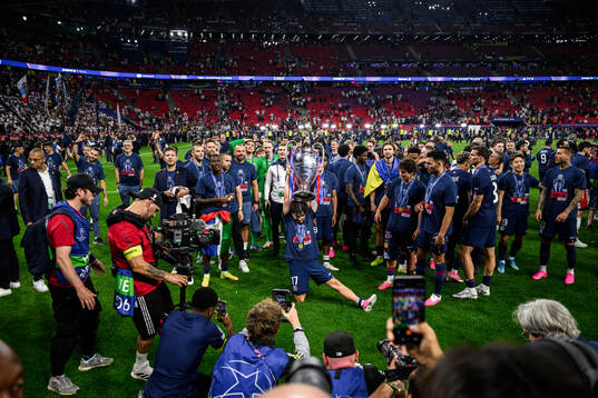 Vitinha of Paris Saint-Germain celebrates with the trophy