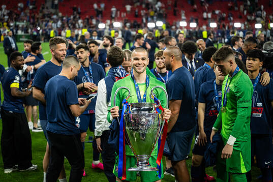 Goalkeeper Lucas Chevalier of Paris Saint-Germain celebrates