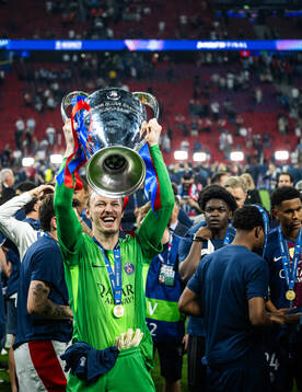 Goalkeeper Matvey Safonov of Paris Saint-Germain celebrates