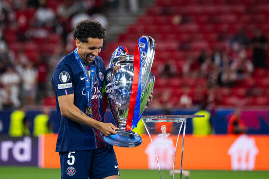 Marquinhos of Paris Saint-Germain celebrates with the trophy