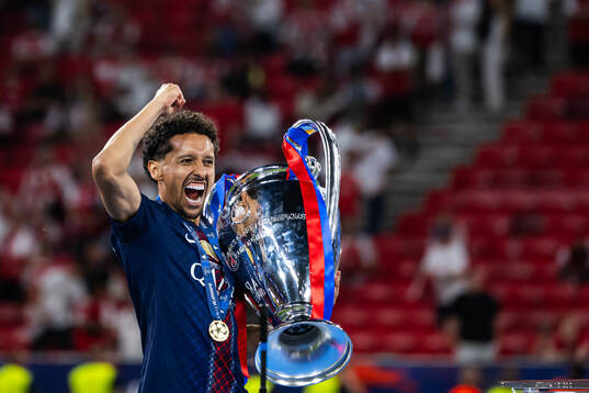 Marquinhos of Paris Saint-Germain celebrates with the trophy