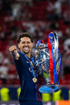 Marquinhos of Paris Saint-Germain celebrates with the trophy