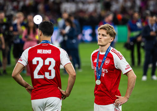 Mikel Merino and Martin Ødegaard of Arsenal look