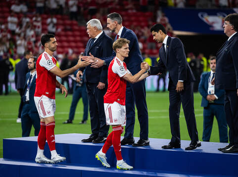 Martin Ødegaard of Arsenal looks as he greets chairman