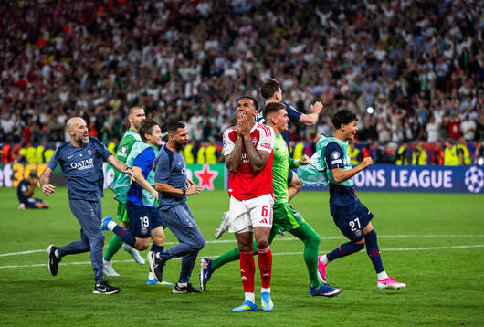 Players of Paris Saint-Germain celebrate and Gabriel of