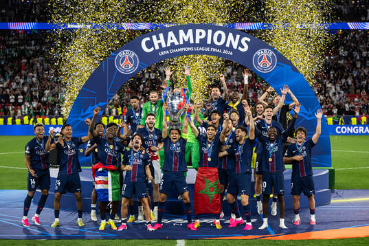 Marquinhos of Paris Saint-Germain lifts the trophy and