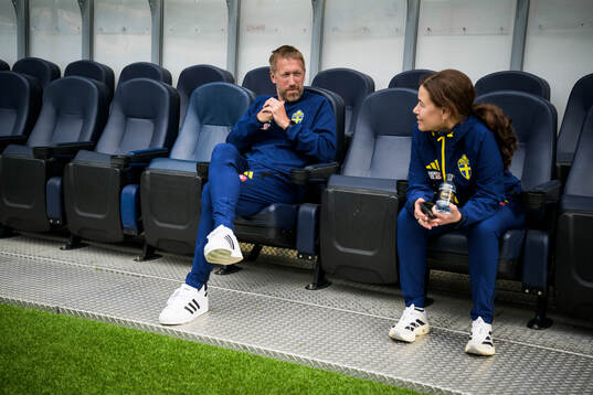 Head coach Graham Potter and press officer Petra Thorén of