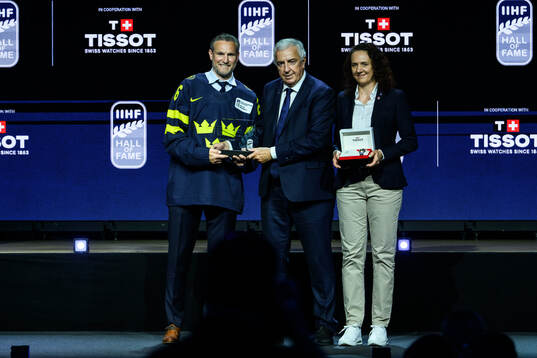 Niklas Kronwall poses for a photo together with IIHF