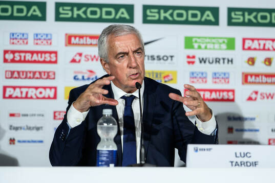 IIHF President Luc Tardif at an end-of-tournament press