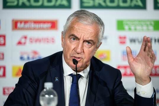 IIHF President Luc Tardif at an end-of-tournament press