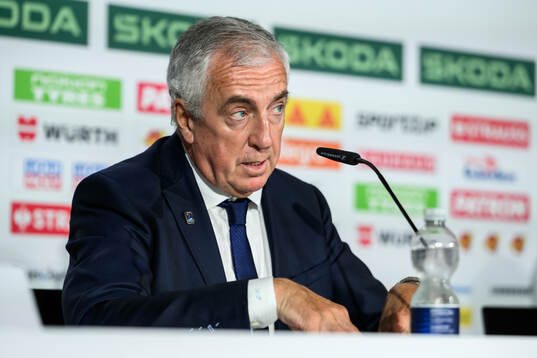 IIHF President Luc Tardif at an end-of-tournament press