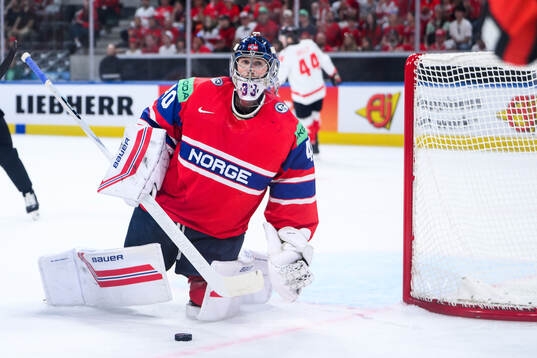 Goaltender Henrik Haukeland of Norway reacts