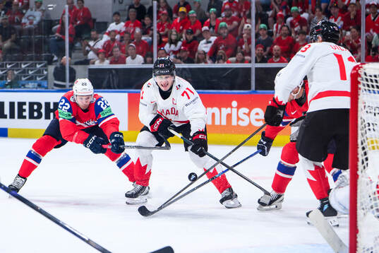 Martin Rønnild of Norway and Macklin Celebrini of Canada