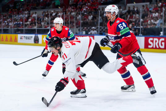 Macklin Celebrini of Canada and Sander Hurrød of Norway